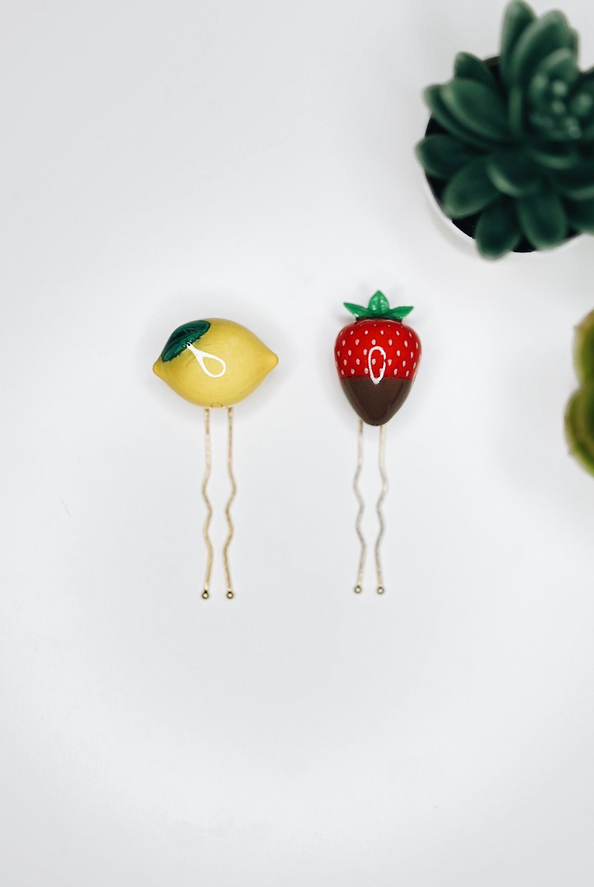 The Citrus & Cocoa set — a lemon and a chocolate-dipped strawberry hair pin